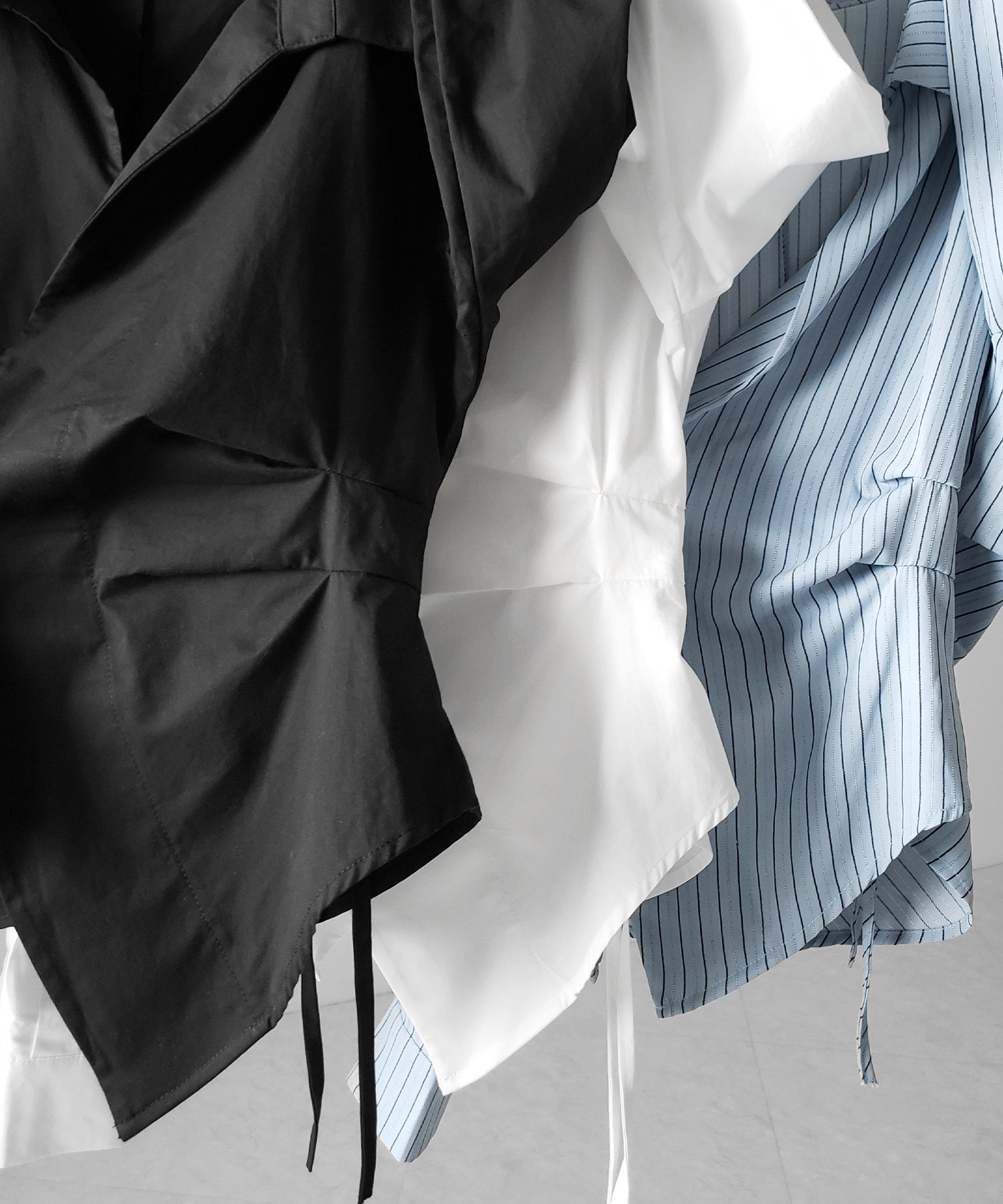 タックレイヤードアシンメトリーミディシャツ / tuck layered asymmetry midi shirts
