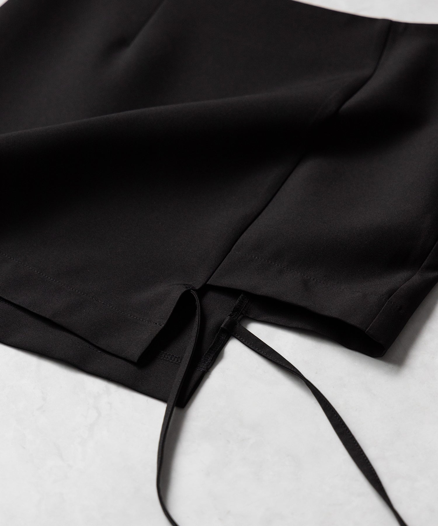 【 2color 】クロスストラップサイドリボンミニスカート / cross strap side ribbon mini skirt
