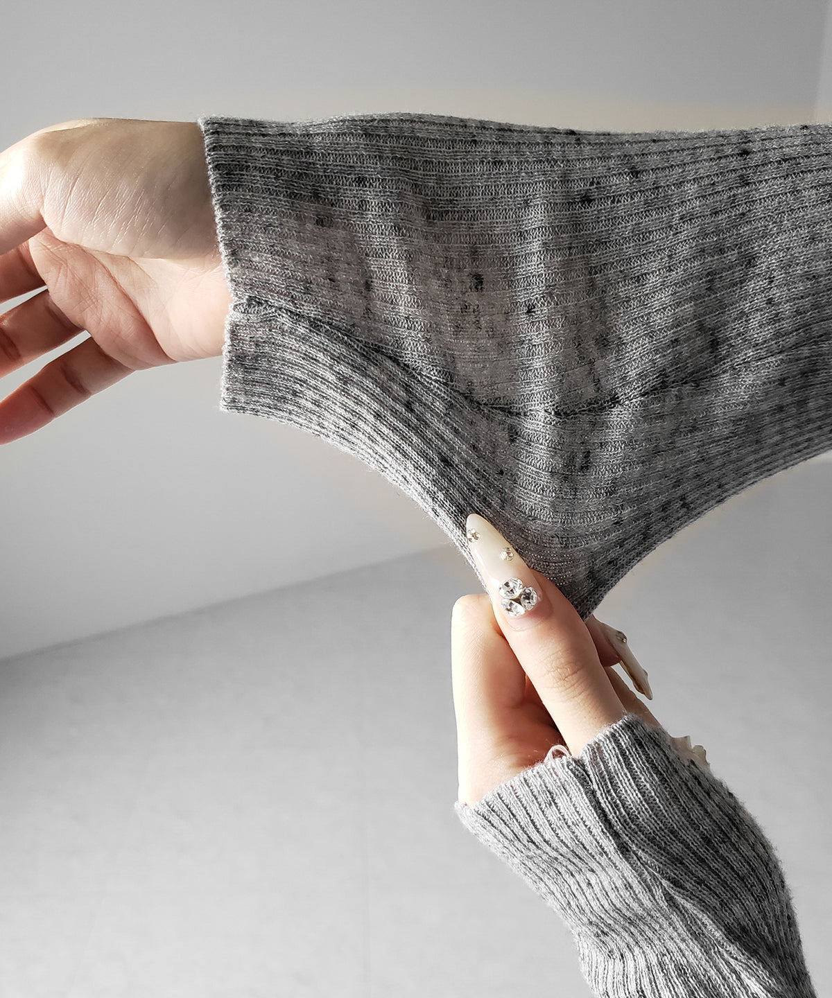 メランジネップルーズニットトップス ／ melange nep loose knit tops